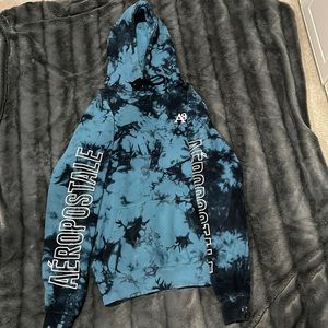 Blue tie dye with logo on back and sleeves